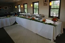Buffet tables with chafing dishes set up in the Café dining room